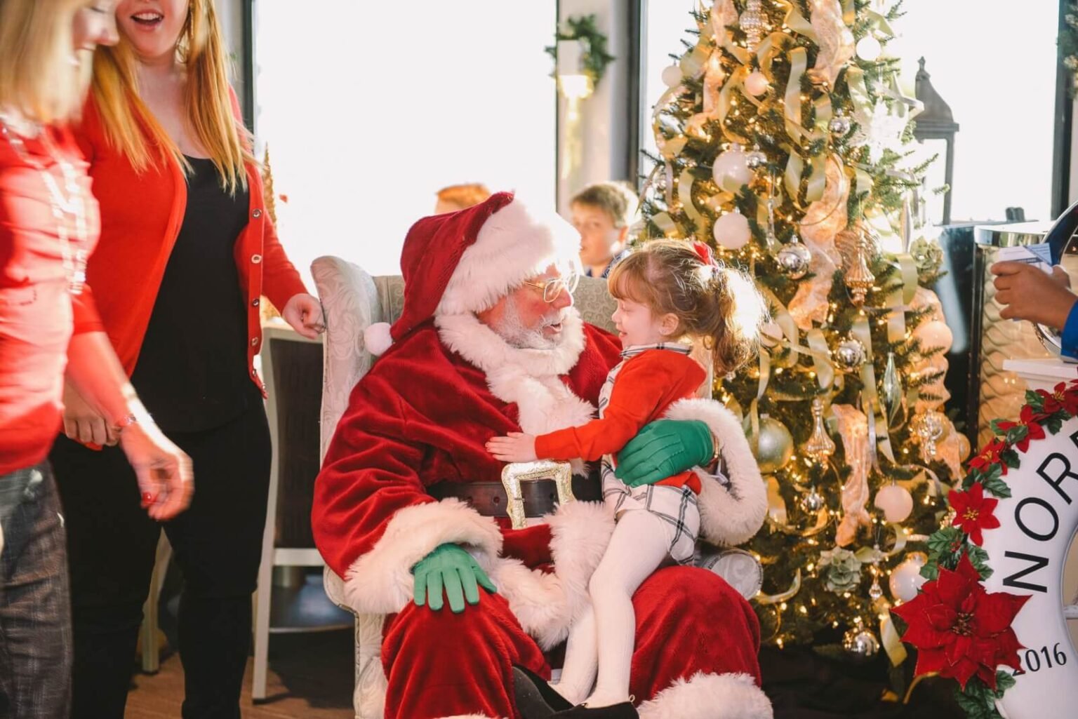 santa holding a baby