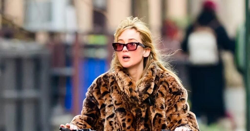 Jennifer Lawrence's Faux Fur Coat & Cult Blue Jeans Make Biking Look Cool