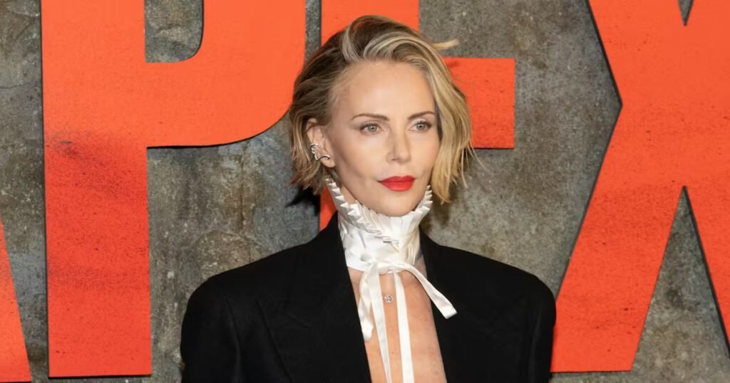 Charlize Theron Goes Shirtless With Just a Dior Collar on the 'Apex' Red Carpet