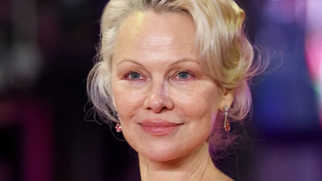 Pamela Anderson’s Feathery Layers Are a Trip to the ’70s—See the Photos Allure