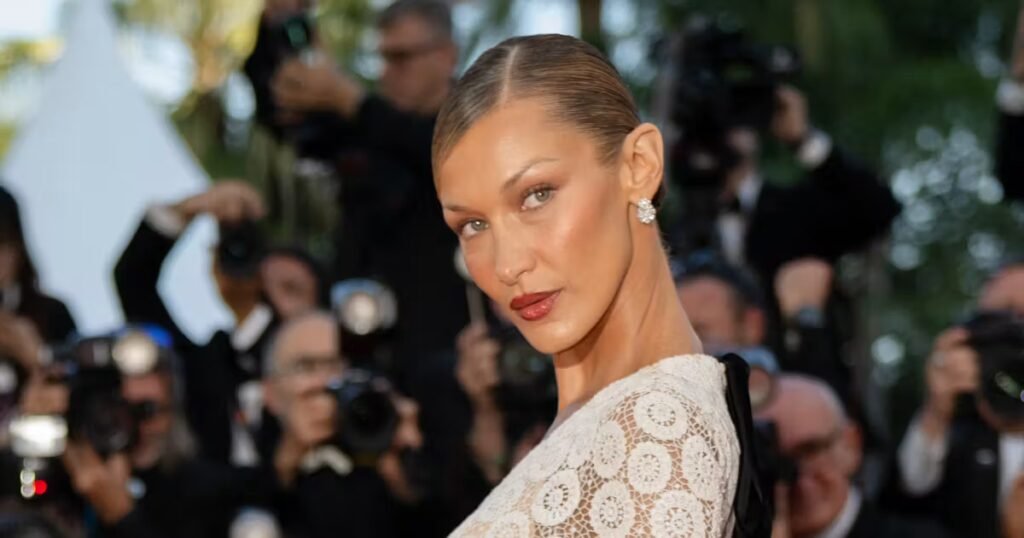 Bella Hadid Wows in Lace Dress Inspired by Jane Birkin at Cannes Bella Hadid Channels Jane Birkin in Plunging Lace Dress in Cannes